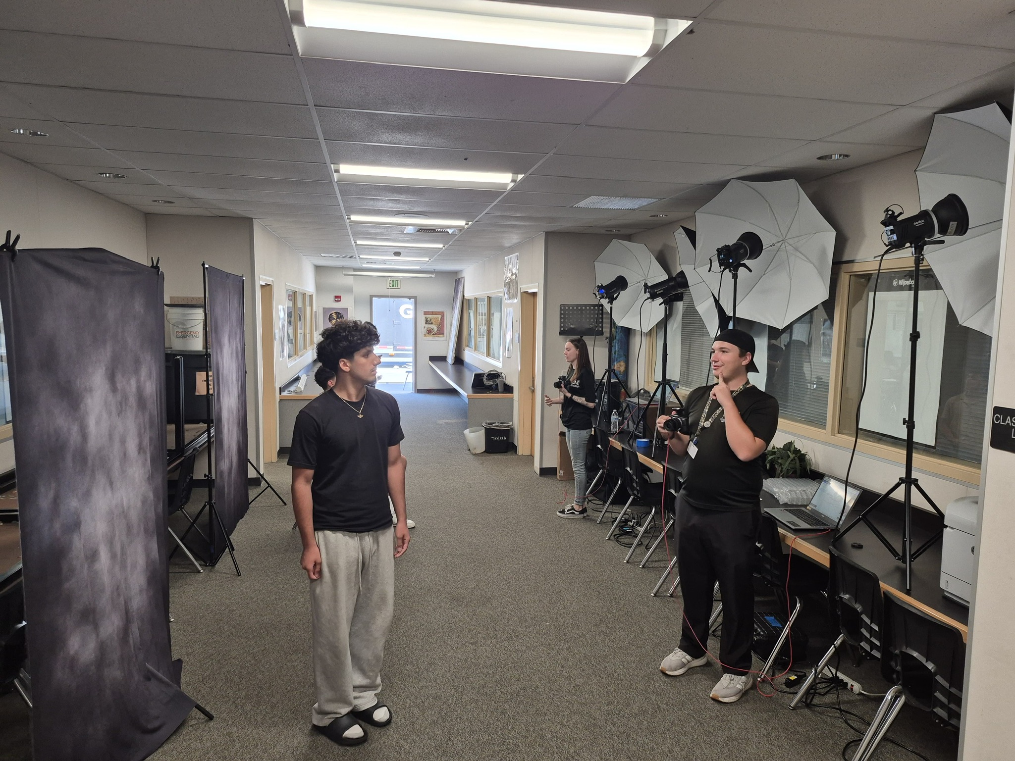 Cherished Memories photographers running a picture-day studio line at a school